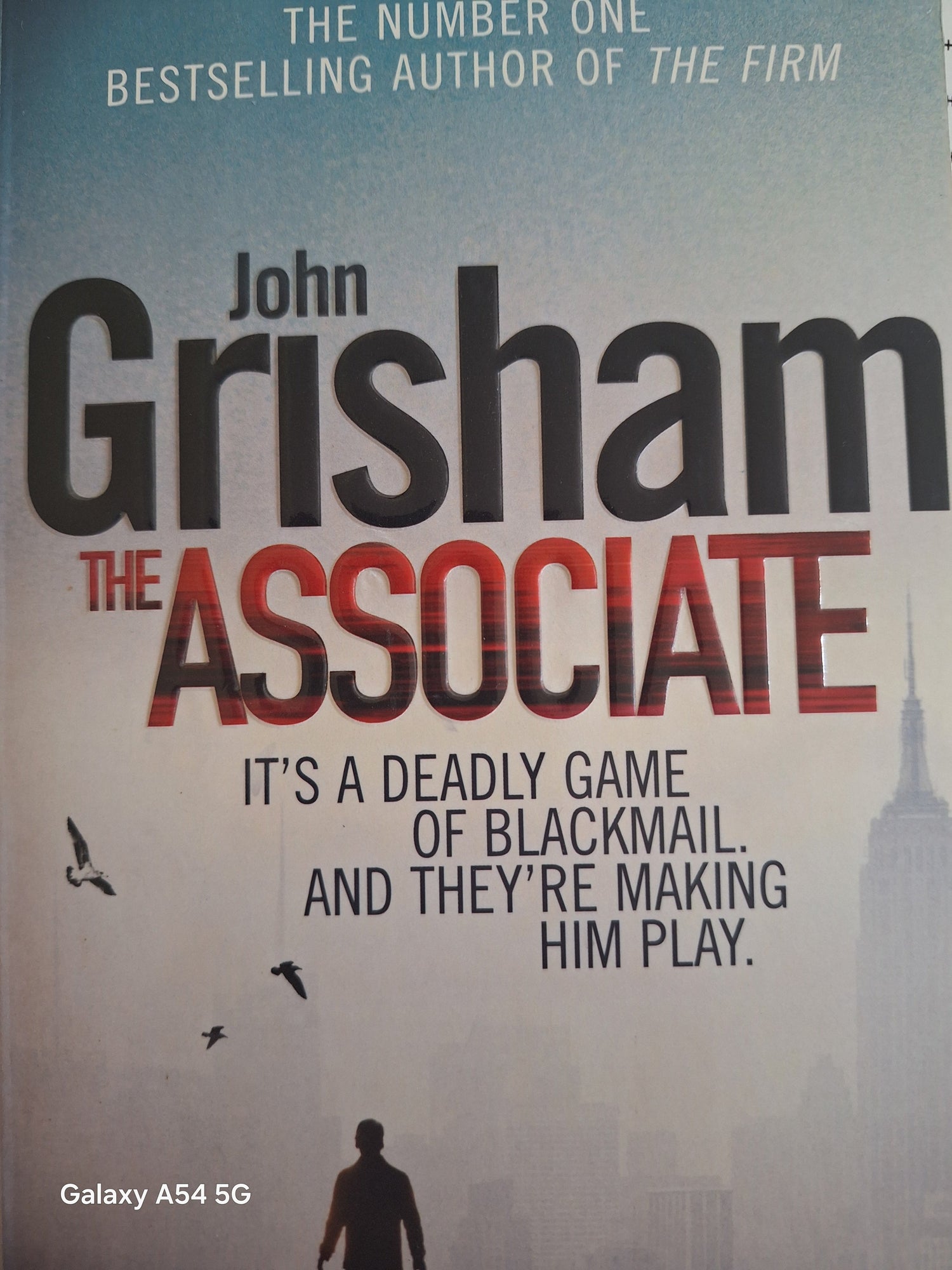 Bargain books by authors featuring John Grisham's The Associate thriller novel cover