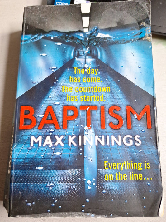Baptism Ed Mallory thriller book by Max Kinnings with a dark blue and black cover featuring a submerged figure and countdown text