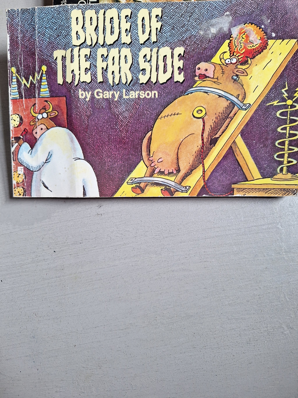 Bride of the far side book by Gary Larson with humorous cartoon cover showing a cow on an electric chair