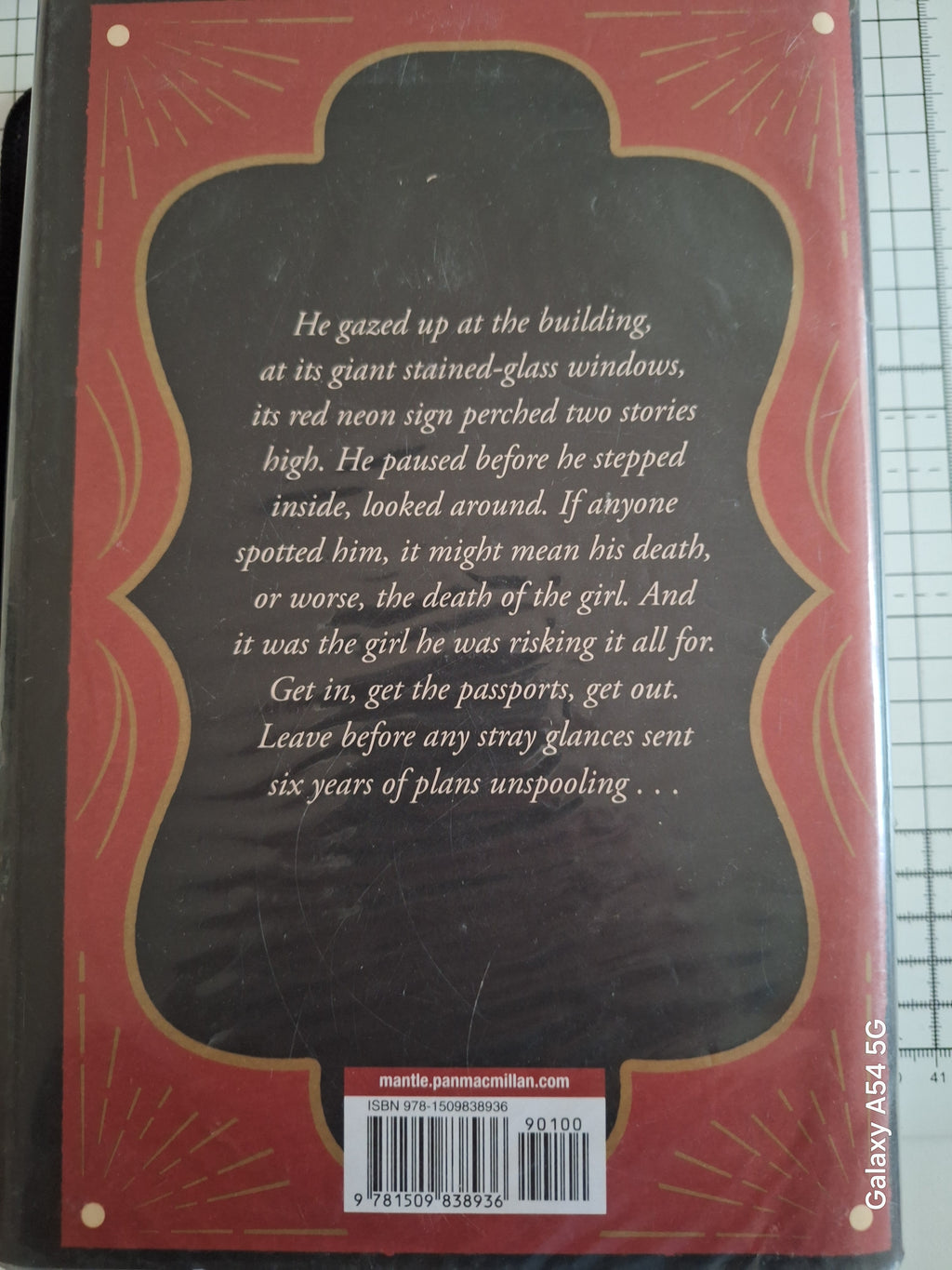 Back cover of Mobsters lament book with red and black design and synopsis text