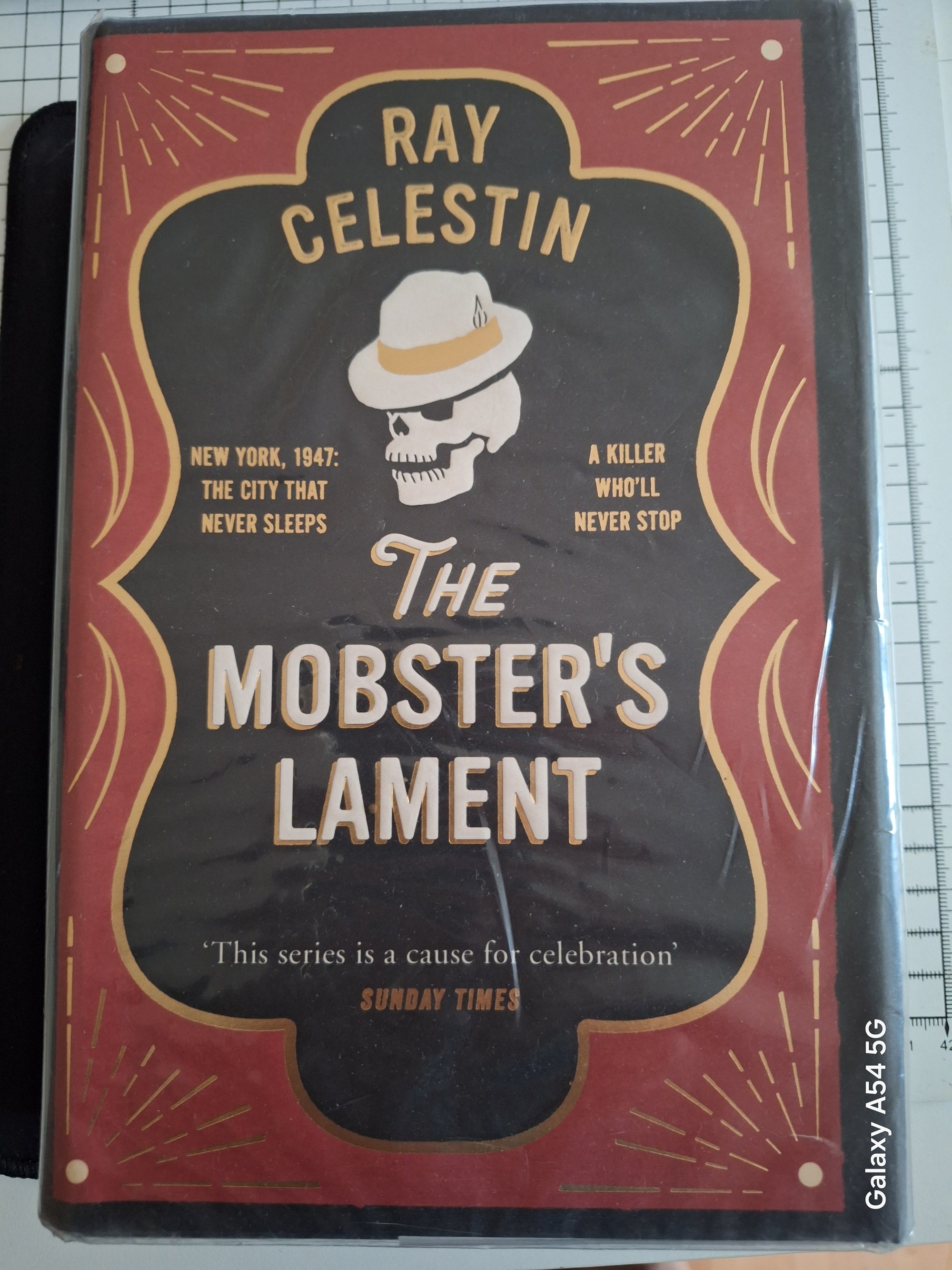 Mobsters lament book by Ray Celestin with skull wearing a fedora on dark red cover by Slightly Read Books