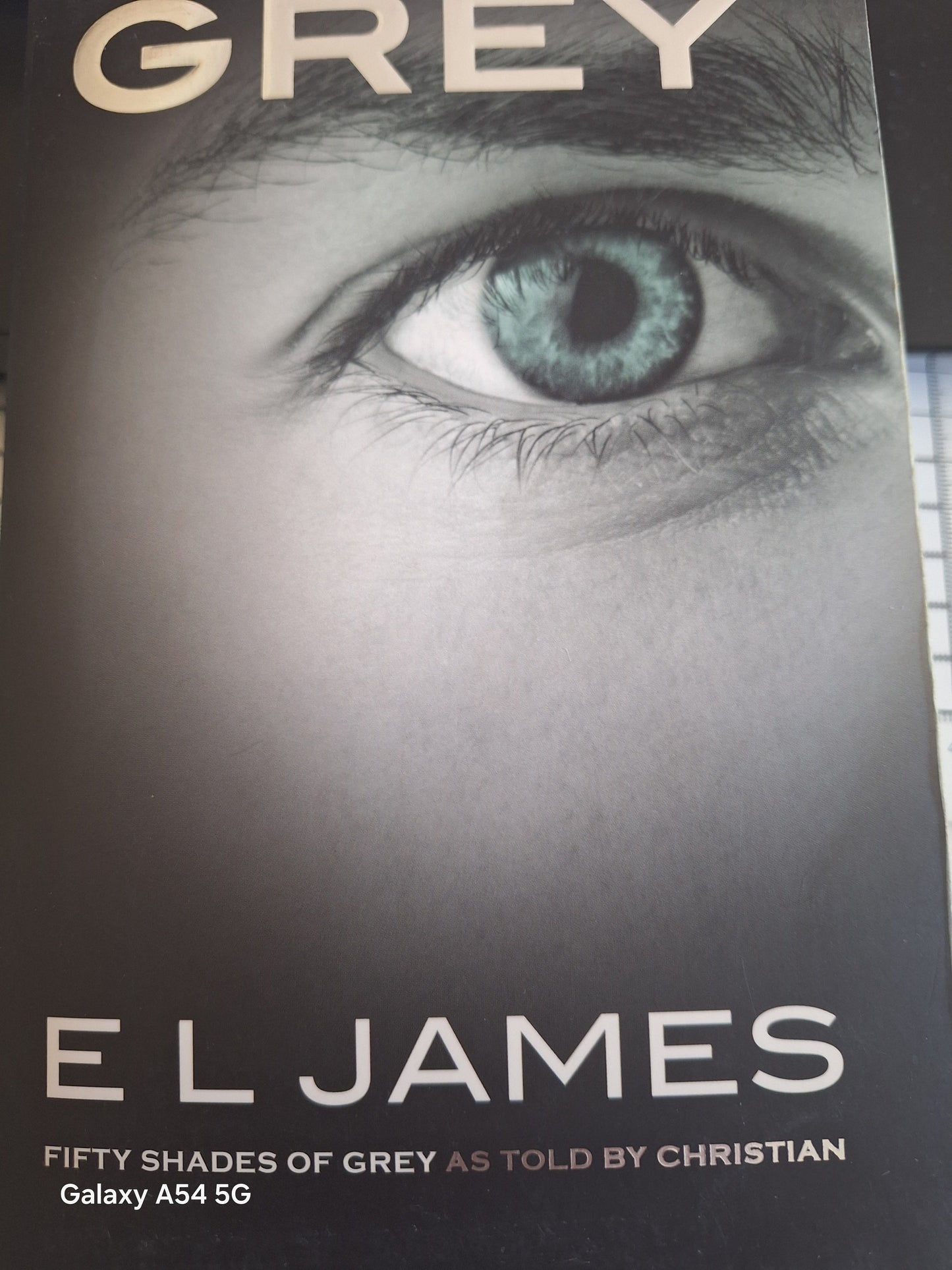 Used copy of Fifty Shades of Grey told by Christian book by E L James featuring striking cover art