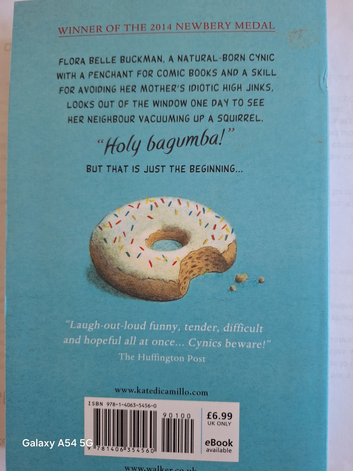 Flora and Ulysses book UK back cover featuring a doughnut illustration and Newbery Medal winner stamp