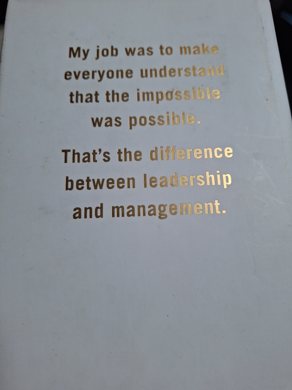 Book cover with inspirational quote about leadership and management using the keyword Leading