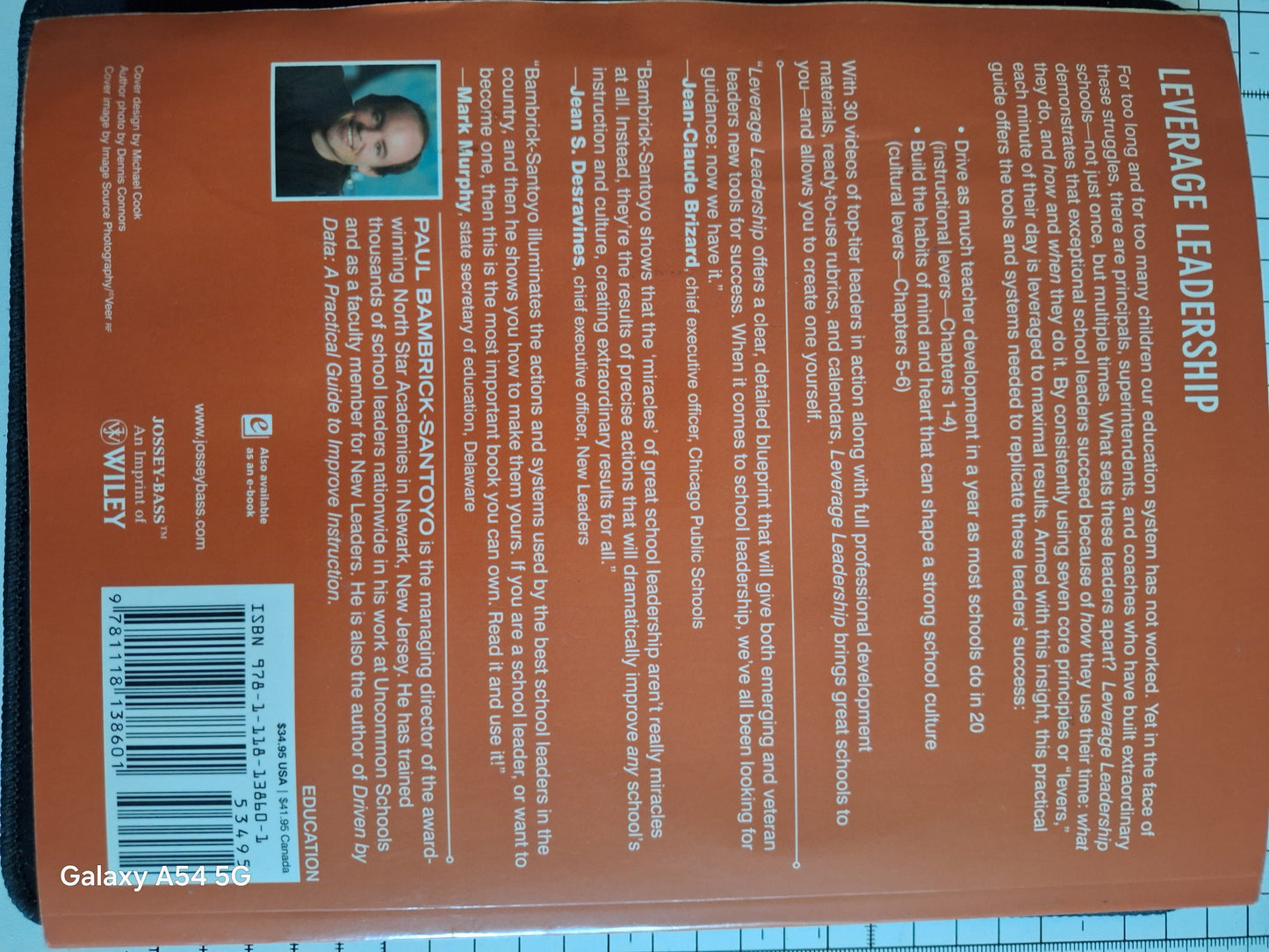 Leverage Leadership guide second hand book by Paul Bambrock-Santoyo with orange back cover and author photo