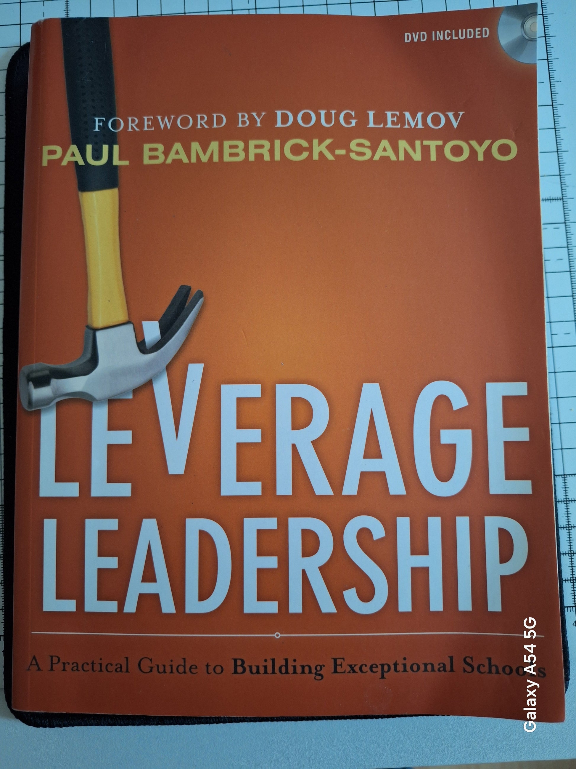 Leverage Leadership guide second hand book by Paul Bambrick-Santoyo with orange cover and hammer image
