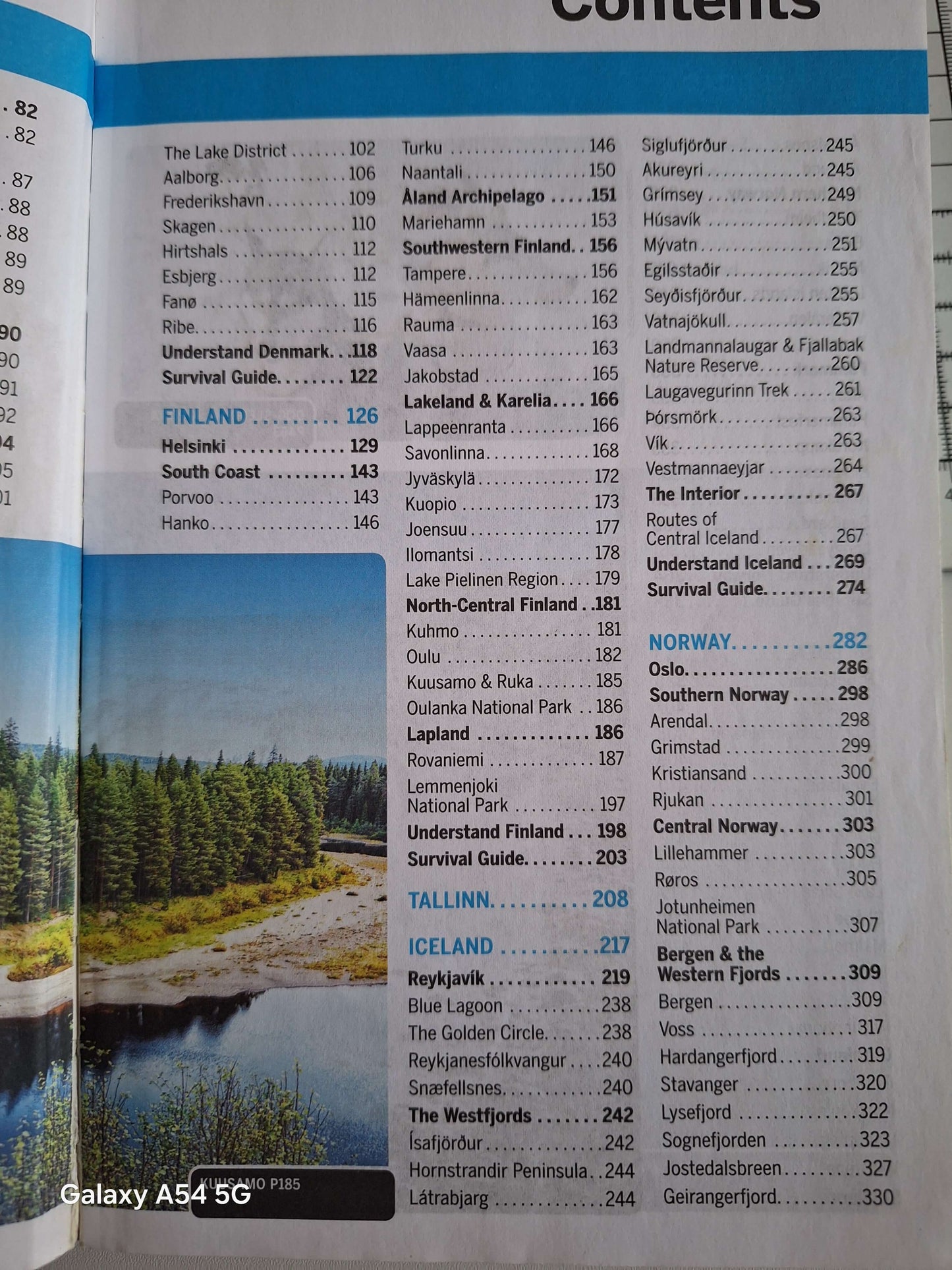 Scandinavia Lonely Planet guidebook contents page with beautiful landscape of Finland, Norway, and Iceland.