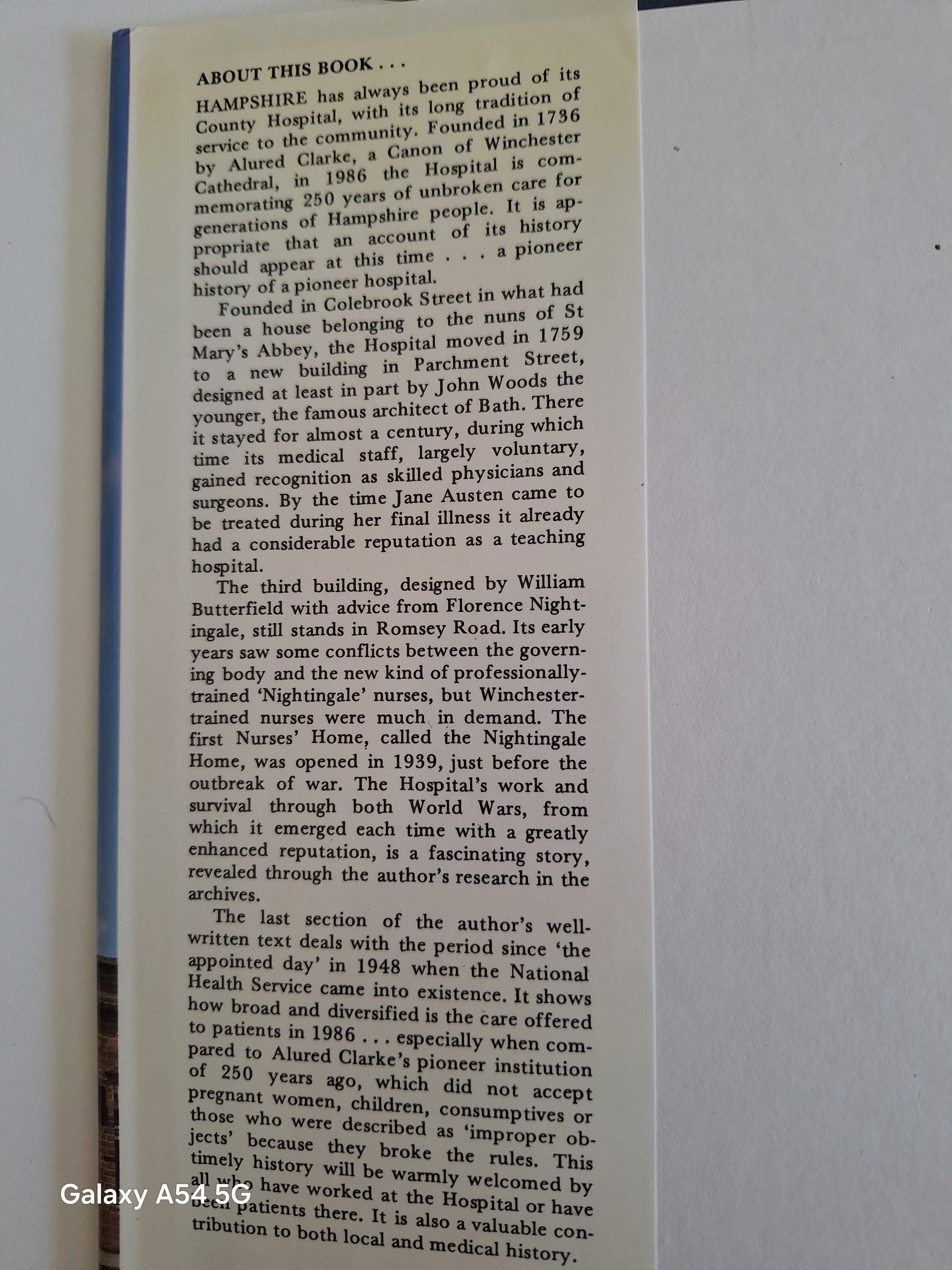 Open Royal Hampshire history book showing detailed text about hospital and local history