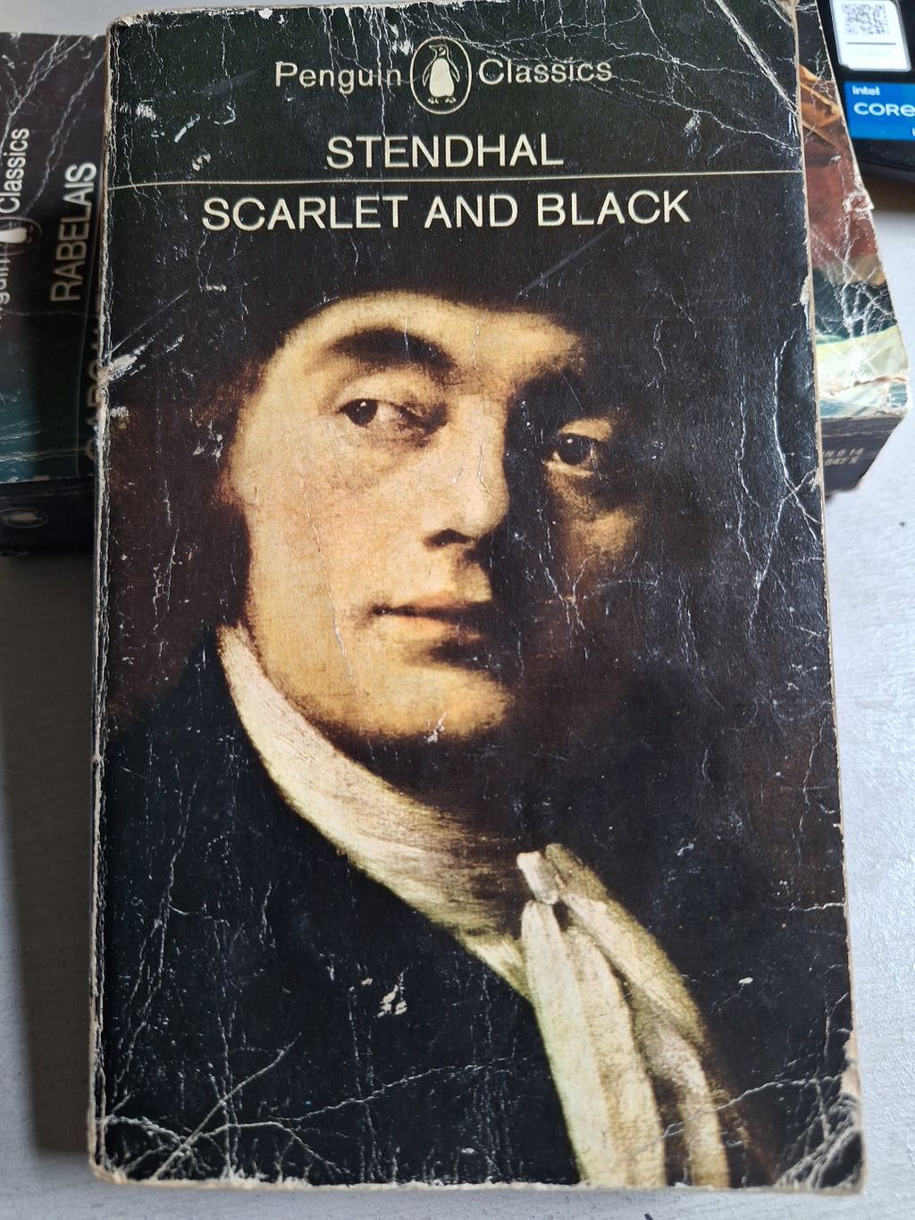 Worn copy of Penguin Classics Scarlet and Black by Stendhal with a classical portrait on the cover