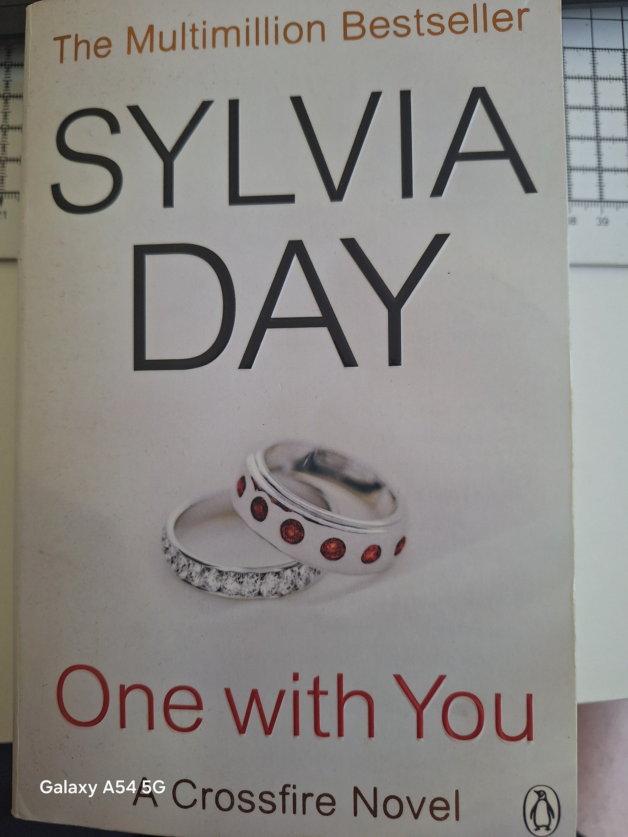 One with You by Sylvia Day, the final novel in the Crossfire series for sale with elegant ring cover design