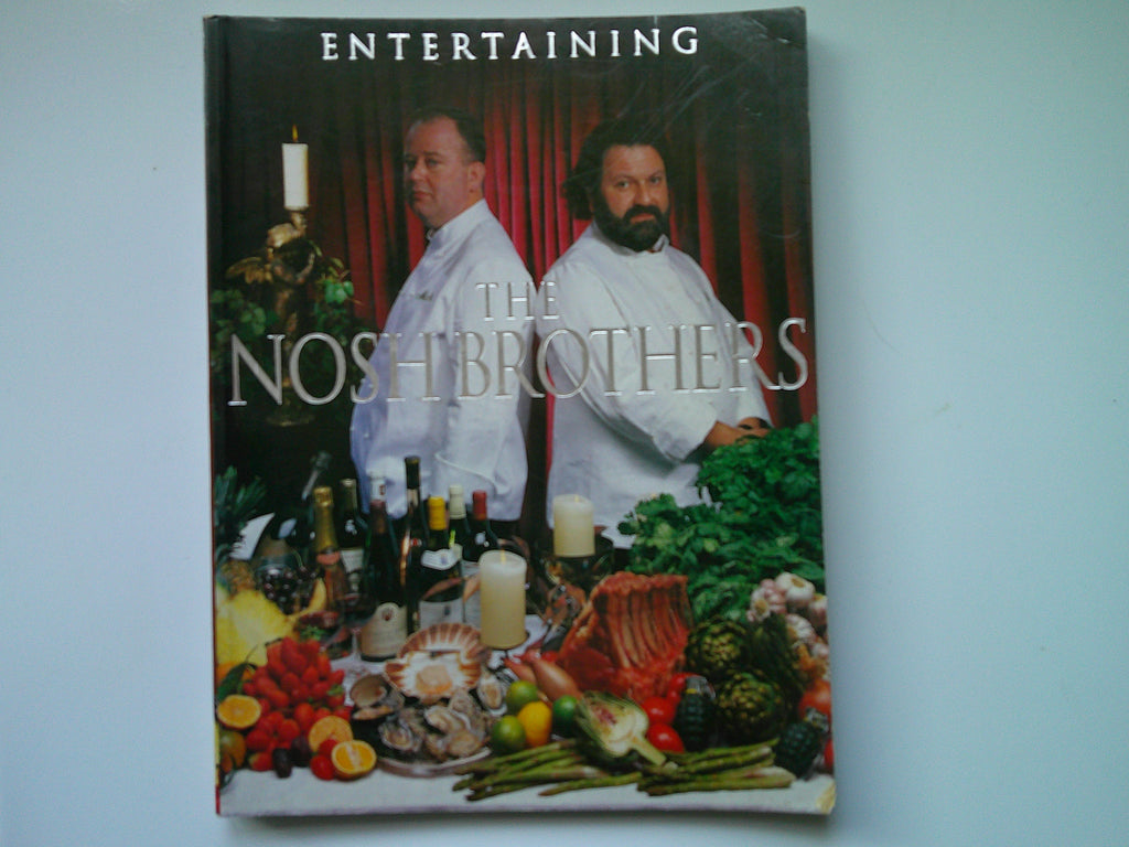 The Nosh Brothers cookbook featuring chefs with a variety of dishes and vibrant ingredients on the cover