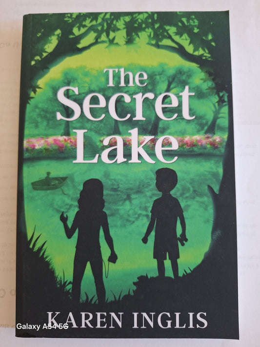 The Secret Lake Karen Inglis book cover featuring two children by a lake surrounded by greenery