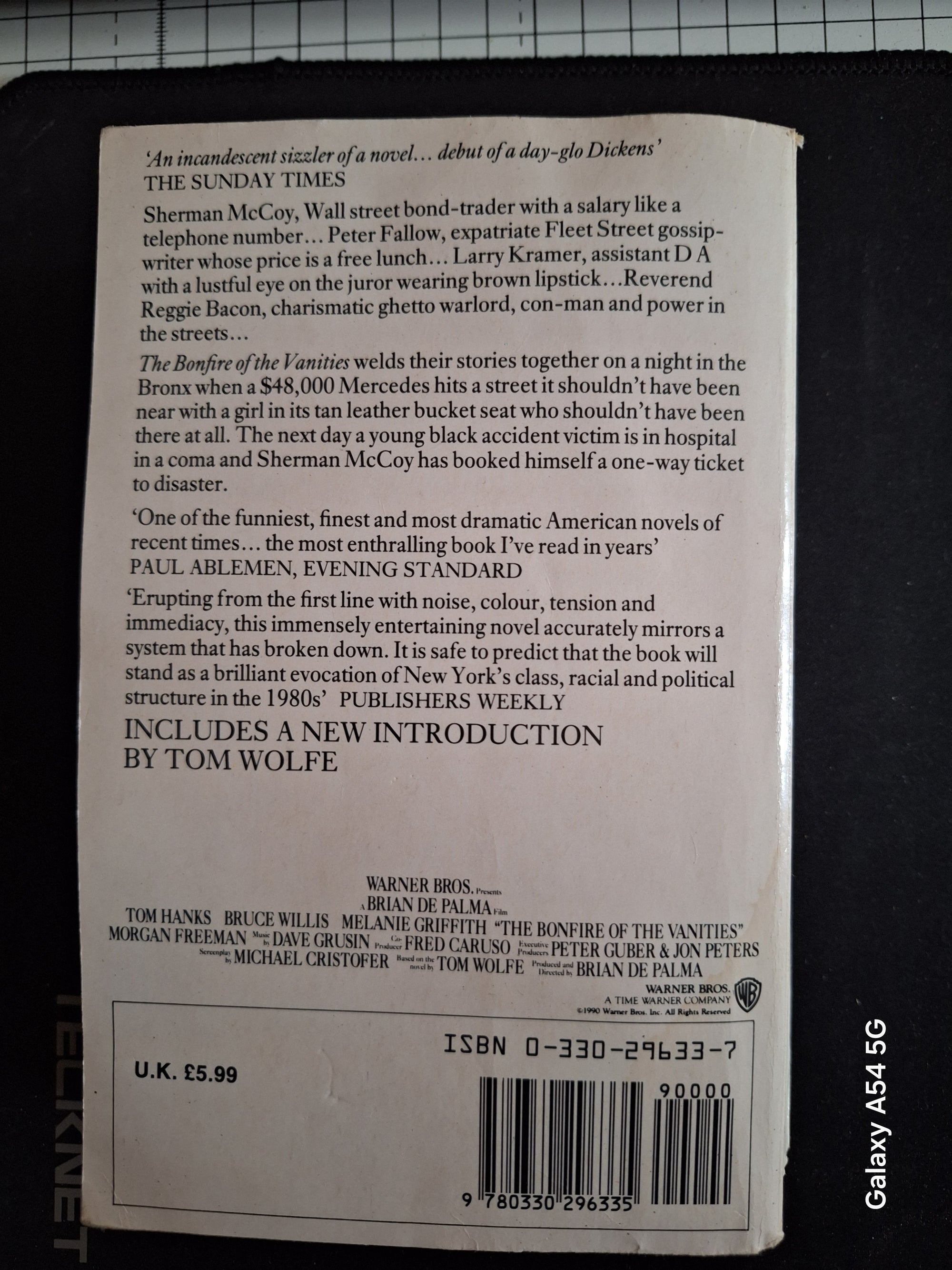 Back cover of The bonfire of the vanities book by Slightly Read Books showing reviews and price