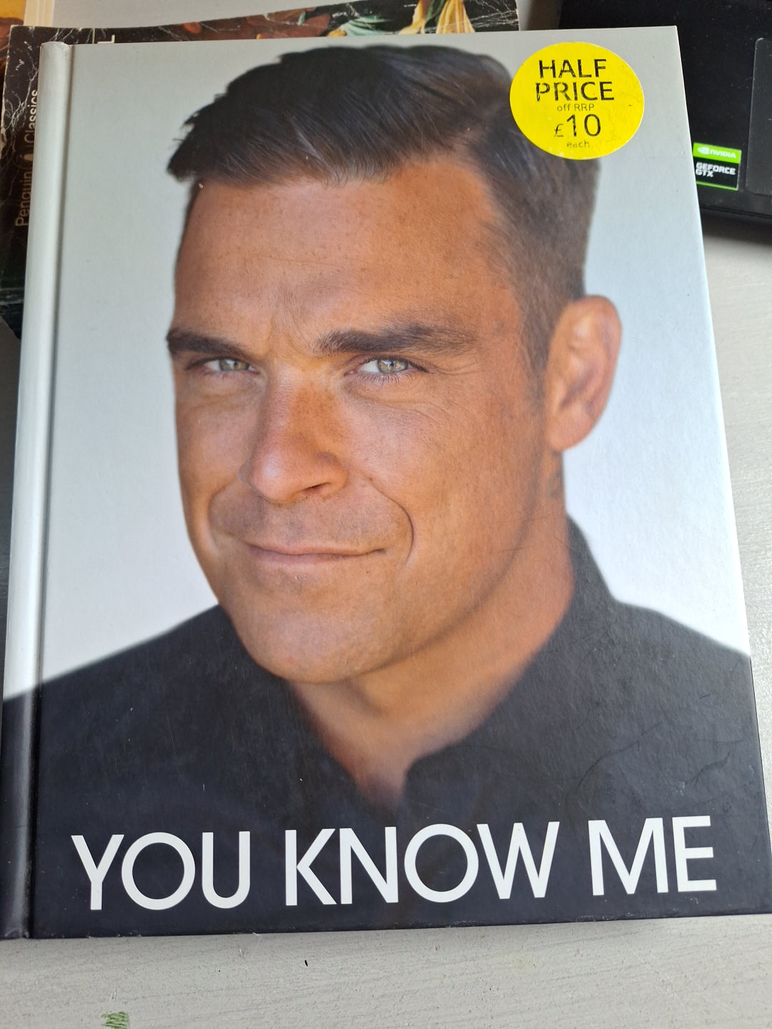 You know me book by Slightly Read Books featuring a close-up of a man's face on the cover with half price sticker